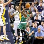 Isaiah Thomas of the Celtics squeezes off a shot despite being swarmed by the Pacers. 