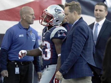 New England Patriots running back Dion Lewis leaves the field after an injury during the second half of an NFL football game against the Washington Redskins, Sunday, Nov. 8, 2015, in Foxborough, Mass. (AP Photo/Charles Krupa)
