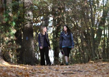 Abbie Hausermann (left) and client Lara Andrews at Wilson Mountain Reservation in Dedham.
