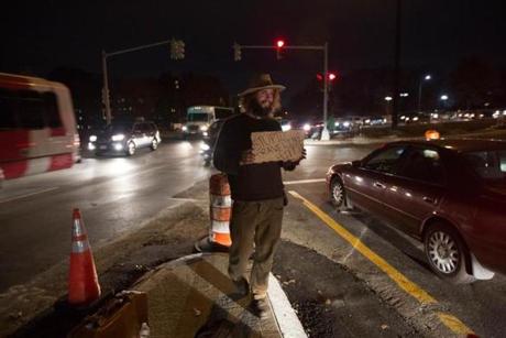 Cambridge, MA - 11/10/2015 - Scott Loren(cq) panhandles along Alewife Brook Parkway in Cambridge, MA, November 10, 2015. Loren, who has panhandled from time to time, is between jobs and is looking for extra cash. (Keith Bedford/Globe Staff) 
