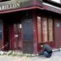 A man laid a tribute to victims of the attacks at the Carillon restaurant in Paris.