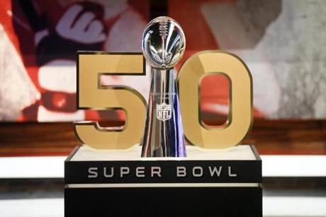 A detail view of the Vince Lombardi Trophy and the 50 numerical symbol indicating the celebration of upcoming Super Bowl 50 is seen during a media availability at the NFL Network studios, Wednesday, Sept. 9, 2015, in Culver City, California. (AP Photo/Danny Moloshok)
