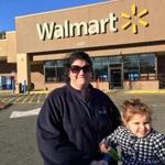 18blackfriday - Rhonda Kable, of Lynn, and her daughter, Leila, in front of the Walmart in Salem. Kable supports last week's decision by the Salem City Council to not allow Walmart to open at 1 a.m. on Black Friday. (Steven Rosenberg/Globe Staff)