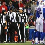 The officiating crew headed by referee Gene Steratore (white cap) handled Monday night?s game.