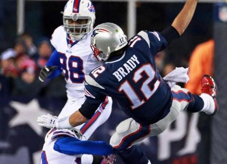 Patriots quarterback Tom Brady had a hard time staying upright against the Bills pressure on Monday.
