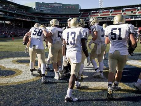 Boston MA 11/26/15 Needham High Joe Gowetski (58) celebrates with teammates after an interception for a touchdown against Wellesley High during second quarter action at Fenway Park on Thursday November 26, 2015. (Matthew J. Lee/Globe staff) Topic: Reporter: 
