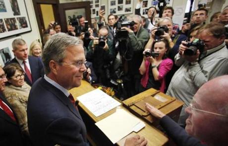 Republican presidential candidate Jeb Bush talled with N.H. Secretary of State Bill Gardner as he arrived to file his papers to be on the primary ballot.
