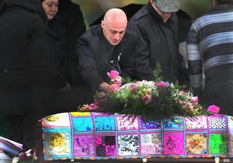 Winthrop-11/28/15- A funeral and burial service was held for Bella Bond, the toddler who became know as Baby Doe after her body was discovered in a trash bag in June on Deer Island in Winthrop. Joseph Amoroso, the child's biological father wept as he took a pink rose from the coffin which was draped in a hand-made quilt with adorned with sayings. Boston Globe staff photo by John Tlumacki(metro)
