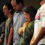 Jennifer Churchill (center), a member of Hope Chapel in Colorado Springs, cried Sunday during its first service since an elder, Garrett Swasey, was killed.
