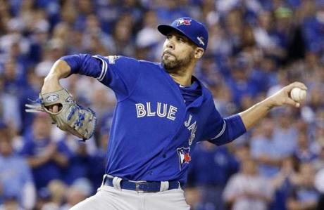 Toronto Blue Jays pitcher David Price flips a ball during a baseball practice in Toronto, Tuesday, Oct. 6, 2015. The Blue Jays will face the AL West champion Texas Rangers in the ALDS opener in Toronto. (Darren Calabrese/The Canadian Press via AP) MANDATORY CREDIT

