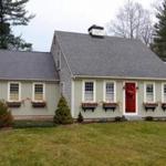 The house sits well back from the street (Route 14) on a 0.86-acre lot.