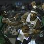 Kings big man DeMarcus Cousins struggles to escape a double team by the Celtics? Jae Crowder (left) and Jared Sullinger.