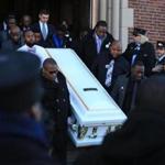 Pallbearers carried Jephthe Chery?s coffin after his funeral at St. Angela Catholic Church. 