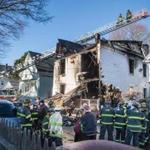 Firefighters worked Friday at the scene of a fatal fire in Lynn.