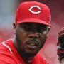 The Reds agreed to trade reliever Aroldis Chapman to the Dodgers Monday, but the deal has been put on hold.