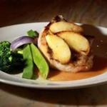 Pan-roasted pork chops with roasted apples and a Gorgonzola sauce at Il Capriccio.