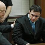 Defense attorney Robert Gray (left) placed his hand on the shoulder of defendant Daniel Holtzclaw (right) as they waited for the verdicts in his trial in Oklahoma City. 