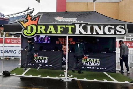 Workers set up a DraftKings promotions tent in the parking lot of Gillette Stadium in October.
