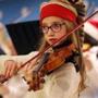 Sophie Fellows played violin during a holiday concert at the Boston Children's Hospital in Boston. 