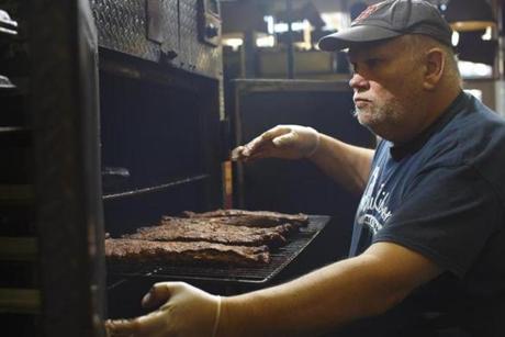Dave Schaefer managed the industrial smoker at Blue Ribbon BBQ in Arlington.
