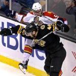 Boston, MA - 12/12/15 - (1st period) Boston Bruins defenseman Colin Miller (48) drives Florida Panthers defenseman Aaron Ekblad (5) into the boards during the first period. The Boston Bruins take on the Florida Panthers at TD Garden. - (Barry Chin/Globe Staff), Section: Sports, Reporter: Fluto Shinzawa, Topic: 13Panthers-Bruins, LOID: 8.2.728844790. 