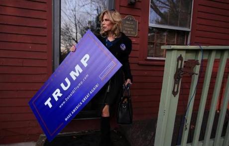 Catherine Leafe prepared to leave her home to attend a campaign event for Donald Trump in Portsmouth, N.H.
