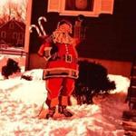 A paint-by-number wooden Santa Claus outside Beverly Beckham's childhood home.