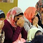 During a vigil and symposium Saturday where speakers stressed the peaceful teachings of Islam, participants remembered the terrorism victims and their families in prayer.