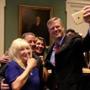 Governor Charlie Baker took a selfie with Lieutenant Governor Karyn Polito, Mark McNeill, and McNeill's fiancee at a ceremony to recognize McNeill and Ainsley ?Lee? Saunders.