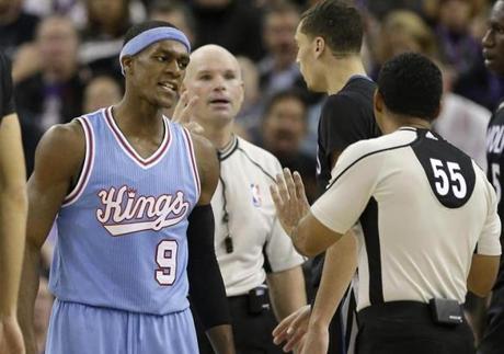 Sacramento Kings guard Rajon Rondo, left, questions official Bill Kennedy (55) about a foul call during the second half of an NBA basketball game against the Minnesota Timberwolves in Sacramento, Calif., Friday, Nov. 27, 2015. The Timberwolves won 101-91. (AP Photo/Rich Pedroncelli)
