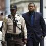 Officer William Porter (right), one of six Baltimore officers charged in connection to the death of Freddie Gray, arrived at a courthouse in Baltimore on Wednesday.