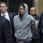  Martin Shkreli was escorted by law agents in New York on Thursday after being taken into custody following a securities probe. 