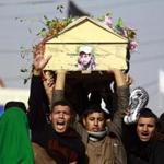 Iraqi mourners on Saturday carried the body of one of the soldiers who were killed the previous day in a so-called friendly fire from a US-led coalition aircraft west of Baghdad.