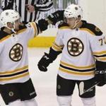 Boston Bruins' Frank Vatrano (72) is congratulated by Ryan Spooner (51) after scoring against the Pittsburgh Penguins during the first period of an NHL hockey game Friday, Dec. 18, 2015, in Pittsburgh. (AP Photo/Keith Srakocic)