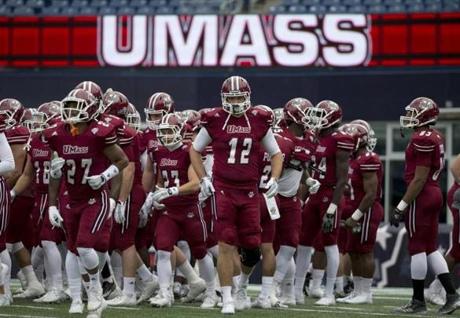UMass players warmed up before an NCAA college football game against Akron in Foxborough on Nov. 7.

