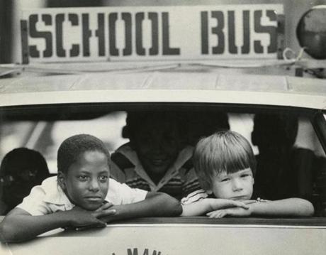 David Patterson, 8, and Chris Russell, 7, rode home from the first day at McKay School in East Boston in September 1979. 
