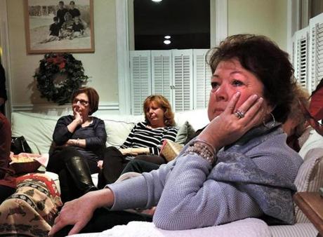 Kathleen Greiner from Marstons Mills, (forground) cried as she watched the HBO documentary film Heroin: Cape Cod, USA at a Parents Supporting Parents Group of Cape Cod meeting in Bourne, along with Carla Ferraguto from Onset (left background) and Maggy Purdy (right) of Sandwich. 
