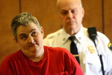 Holly Fowler, 42, listened to the court therapist during her arraignment in Haverhill District Court on Monday.
