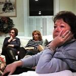 Kathleen Greiner from Marstons Mills cried as she watched the HBO documentary film ?Heroin: Cape Cod, USA? at support group. She was joined by Carla Ferraguto from Onset (left) and Maggy Purdy (center) of Sandwich. 