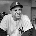 FILE Ã? New York Yankees catcher Yogi Berra at Yankee Stadium in New York on June 13, 1956. Berra, one of baseballÃ?s greatest characters and a mainstay on 10 Yankees championship teams, died on Tuesday, Sept. 22, 2015. He was 90. (Sam Falk/The New York Times)