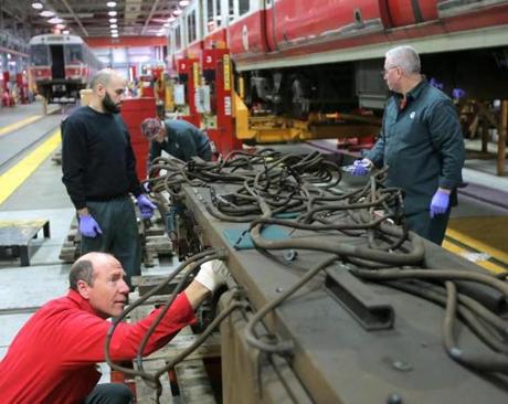 Boston, MA - 04/09/15 - Repair foreman Tom Pearson readies the propulsion unit (a sort of transmission for power distribution to a train's motors) of a Red Line train for repairs at the MBTA maintenance facility in South Boston. Lane Turner/Globe Staff Section: METRO Reporter: levinson Slug: 17mbtaolympics
