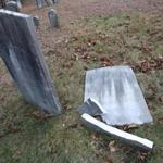 Thirty-three tombstones  were affected, some of them toppled over and several smashed completely. 