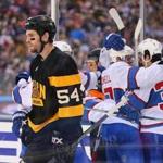 Foxborough 01/01/16 The Boston Bruins vs Montreal Canadiens in the Winter Classic at Gillette Stadium. Bruins Adam McQuaid skates away from celebrating Canadiens after Canadiens Paul Byron's 2nd period goal to put them up2-0. Boston Globe staff photo by John Tlumacki(sports)