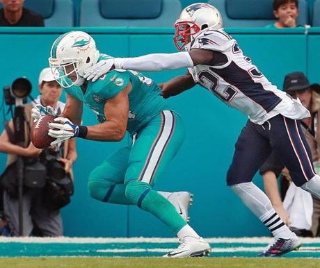 Dolphins TE Jordan Cameron (left) snared what would turn out to be the game winning touchdown, as he beat Patriots DB Devin McCourty (right) for a fourth quarter touchdown pass that put (with the PAT) Miami ahead 17-10, on their way to a 20-10 victory. 
