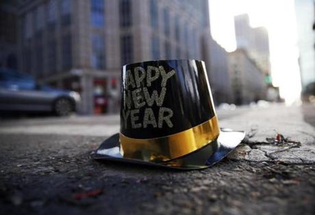 A hat from New Year?s Eve celebrations sat on Boylston Street. 
