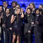 Kaley Cuoco (center) and the cast and crew of 