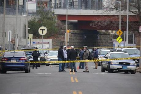 Authorities searched the scene where a Boston police officer was shot Friday morning. 
