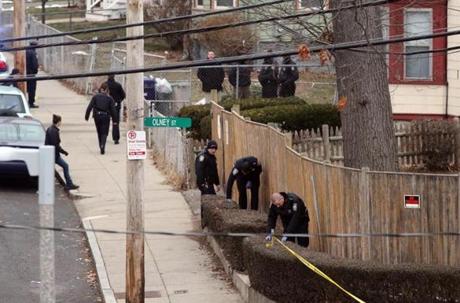 Authorities investigated the crime scene on Rosseter Street after a Boston police officer  was shot in the leg Friday morning. 
