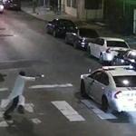 In this frame from a video provided from the Philadelphia police, Edward Archer moved with a gun toward a police car driven by Officer Jesse Hartnett in Philadelphia. 