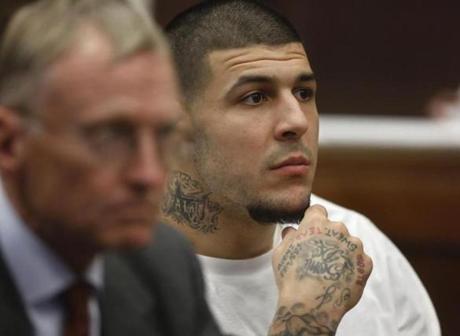 Former New England Patriots NFL football player Aaron Hernandez, right, sits with defense attorney Charles Rankin, left, while attending a pre-trial hearing at Suffolk Superior Court, Tuesday, Dec. 22, 2015, in Boston. Hernandez is charged with killing two Boston men in 2012 after a chance encounter at a nightclub. (AP Photo/Steven Senne, Pool)
